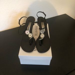 Manolo Blahnik black leather strap thong sandal, 2 1/2” heel w/3 button detail.